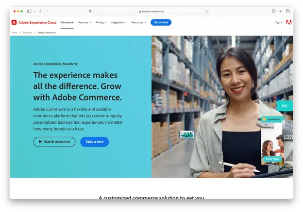 Screenshot of Adobe Commerce (Magento) website showing a warehouse scene with a smiling woman holding a tablet. The left side of the page features a light blue background with the headline, 'The experience makes all the difference. Grow with Adobe Commerce